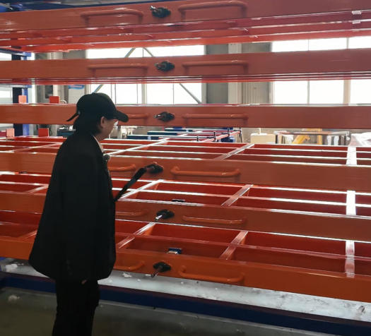 Sheet metal storage rack systems of manufacturing facilities